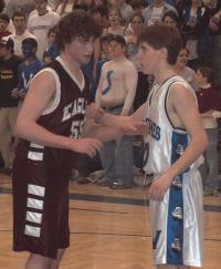 Juniors Austin Olson (left) and Nate Merrill (right) guarding one another during last Saturday's playoff game.