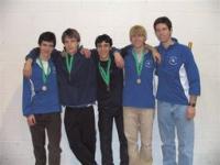 The 4x800 relay from left, Corey Melnick, Mike Sorrell, Theo Spencer, Joe Carter and coach Jim Becker.