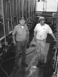 (L to R): Jim Danyow and Son Brett at family farm milking parlor on Walker Road in Ferrisburgh.