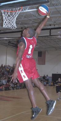 Fennell “Sweet Magic” Hicks sailing through the air in Police Explorers Basketball Fundraiser.