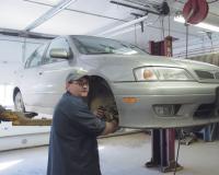 John Chicoine checks the brakes on a vehicle brought in for service  at County Tire, Steve Dupoise and his staff of factory trained technicians like John will make sure that your vehicle is ready to roll before you leave their business.  County Tire has a long standing reputation for customer satisfaction.  They have earned the name “The under the car specialists.”