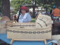Louise Forbes from Cornwall stands amongst a few of her beautiful handmade baskets.
