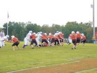 J.J. Mackey #14 pitches to #42 Jeremy Peterson following #3 Sean Harrison, while #36 Chad Foley prepares to block down on the Mt. Anthony defenses end. Up front #53 Eric Fifield, #78 Robbie Harrison and #63 Tyler McNaulty clear out the right side. The Tigers where 2 and 0 heading into an away game vs. Lyndon Institute on Saturday, Sept. 16th, 2006.