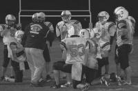 MUHS Tigers Head Coach Peter Brakeley plans some final minutes strategy with the Tiger offensive unit in a game against Rutland on 9-29-06. The Tigers won 20-18 to go 5-0 on the year.