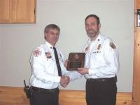 Alan Mayer Fire Chief of the Year, New Haven Fire Dept. receives his award from Dean gilmore 2006 President of the ACFA.