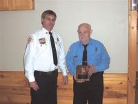 Earl Fisher of the Ferrisburgh Fire Dept. receives his award from Dean Gilmore 2006 President of the Addison County Firefighters Assoc.    