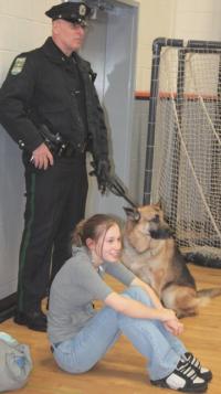 Officer George Merkle and his dog Blade enjoy the Court Jesters Comedy Basketball team and Police Explorers game with a young fan at MUHS gym on 3-16-07. Many youngsters came by to visit George and his K-9 during the game.
The explorers on the roster were: Mike Kemp, Shane Morin, Bailey Mills, Bill Austin, Kevin Emilio, Seth Fisher and Leslie Davignon.
Coach: Chris Perkett
Asst..: Kayla Anderson
Manager: Austin Wedge