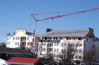 New condominium construction as seen looking west from the National Bank of Middlebury Branch Office on Seymore Street.  Naylor & Breen Builders crew members can be seen at far left working on the roof of the complex.   