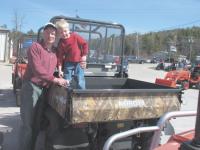 William John Bergman, age 5 and his dad from Ferrisburgh check out the Kubota RTV900 Camo Utility Vehicle during the Open House on Saturday, April 21st at Champlain Valley Equipment located on Exchange St., Middlebury.