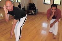    Left-Moo Gong Do School Director Scott Smith teaches Damien Ducharme a move during a class at Middlebury Fitness on June 26th.  Moo Gong Do is a Korean Martial Arts Discipline and lifestyle begun by Master Dae Yong Kim.