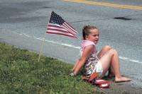 This young lady not only had a great spot to view the 2007 Bristol 4th of July Parade, she also had her spot nicely decorated with red, white and blue.