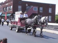 The Addison County Firefighters Association horse drawn wagon leads this years parade for The Vermont State Fightfighters Convention.