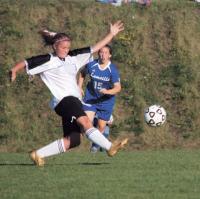    Tigers Alex Clarisse moves the ball upfield against a Lamoille defender in Thursday’s 2-0 loss to the Lancers in Middlebury.