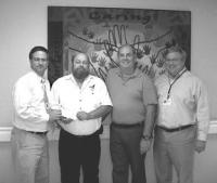 Kent Wright, President of the Addison County Eagles, presents a check for $7,000 to Ron Hallman, James Daily and Charlie Liberty of Porter Hospital.