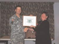    Major Randall Gates of the National Guard Family Readiness Group presents a certificate to Vergennes American Legion Auxiliary Unit 14's president, Pam Norton acknowledging the Unit's contribution to the Family Readiness Charitable Fund.  The Fund helps with imminent needs of guard families.  The presentation was held at Post 14's annual Veterans Day dinner. 
   Donations may be made to The Vermont National Guard Charitable Fund c/o
Captain Lee-Ann Belval, 789 Vermont National Guard Road, Colchester, Vermont 05446-3099.  These donations go to the non-profit which then turns around and uses them for emergency requests from our soldiers, airmen, and their families.  Each donation is recognized by a letter for tax purposes.