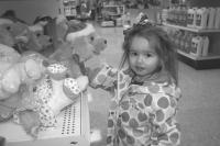 Scarlet Carrara, 2, is more interested in toys than pancakes at Agway’s Annual Pancake Breakfast.
