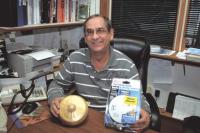 Pittsford Vermont Fire Chief Tom Hooker shows an antique firm alarm (left) and a modern photoelectric smoke and carbon monoxide detector (right). Hooker urges all of us to check our smoke and carbon monoxide detectors regularly.