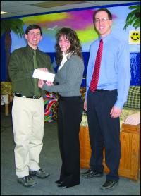 (LtoR): Michael Reiderer, director, Boys & Girls Club of Greater Vergennes, receiving a donation from Laurie Barrett, branch manager, and Christopher Lapierre, commercial lender, at National Bank of Middlebury.