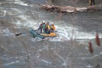 LtoR Members of the Saranac Lake N.Y. Fire Department Technical Rescue Team (S.F.D.T.R.T.) ride rapids as they are hauled towards a large pile of flotsam near the falls by members of the Middlebury Fire Departments Technical Search and Rescue team. Saranac team members were using an underwater camera mounted on a long probe to search for Nicholas Garza or any evidence that could relate to his disappearance. The search was conducted over a two day period of time on Wednesday and Thursday, April 9th & 10th, 2008.