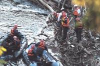 Members of the Vermont State Police Search and Rescue team along with members of the Colchester Technical Rescue Team prepare to recover the body of Nicholas Garza from beneath floating debris in Otter Creek on Tuesday evening May 27th, 2008. Middlebury Police have led the investigation and search efforts into Nicholas Garza’s disappearance. The Garza case remains under investigation.