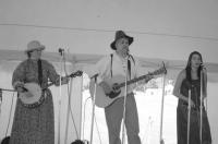 Rising Irish group O'hAnleigh, whose music has been heard on radio stations in 36 countries, played at this year's Vermont History Expo in Tunbridge. The name got converted from Gaelic to Hanley in crossing the Atlantic, and the group's leader is no other than Middlebury's own Irish cop, Chief of Police Tom Hanley. The singing of Rebecca Hanley (at Tom's left) is one of their strengths, and the versatile Cindy Hill (banjo here, fiddle at other times, alto vocals) is one reason they can do so much as a trio. Their debut CD 