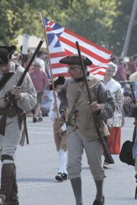 Minutemen march in the 2008 Bristol 4th of July parade in front of an overflow crowd.