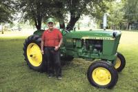Larry with a beautiful vintage John Deere tractor.