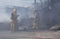 Salisbury firefighters prepare to extinguish the last remnants of a barn fire at The Nop Brothers & Sons cattle barn.