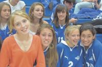 Sophomores at VUHS Homecoming Pep Rally smile as they plan their attack for Saturday soccer games.