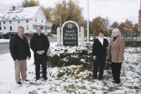 LtoR  Dr. Kevin Parizo Parish Music Director, Father William R. Beaudin Pastor of Saint Mary’s Parish, Monique Almquist Principal of Saint Mary’s School and Sally Foley who was instrumental in leading the effort to reopen the school in 1998 stand in front of their school in Middlebury.  Saint Mary’s is celebrating its 10th Anniversary and they invite everyone to their Annual Christmas Concert on December 14th at 2:30 p.m.  The popular concert will take on a special celebratory theme this year.