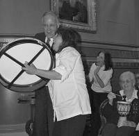 Gov. Douglas drums along with Dechen Rheault and the Living Well Family Band at the Statehouse.