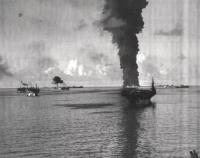 Photograph documenting the 100 foot flames as the USS Mississinewa sank from a suicide Japanese submarine known as a Kaiten.
