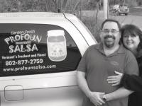 Tom and Linda Fountain-Provost the owners of Profoun Salsa, standing by the salsamobile.