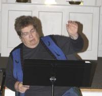 Director Ann Sullivan takes the group through a new piece.