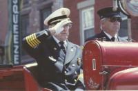 Chief Jackman salutes the reviewing stand during the 2009 Memorial Day Parade. Driving the 1925 Boyer is VFD longtime member Mike Collette.