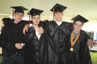 MUHS Grads L to R:  Sean Higgins of Ripton, Alex Kansky of Middlebury, Daniel Boucher of Middlebury and Dana Desautels of Salisbury enjoy some breakfast before the Middlebury Union High School 2010 Commencement at the Memorial Sports Center.