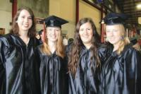 L to R: Ashley Cormier of Middle-bury, Emmy Hescock of Cornwall, Rachel Lynch of Middlebury and Kali Trautwein of Middlebury take time for a quick pick before they had to join the graduation processional at the 2010 Commence-ment for Middlebury union High School.