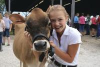 Megan Watkins of Middlebury nuzzles her well groomed animal named Skye. It looked like the sky was the limit for this dynamic duo. Field Days 2010 was a photo album of great expressions like the one above near the youth area.