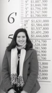 VUHS Sophomore Jennifer Morley sees how she measures up against the value of stacks of newly printed money at the Bureau of Engraving in Washington DC.