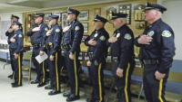 Joining together with all assembled in the Pledge of Allegiance, Chief Merkel and his officers open the evening awards gathering.