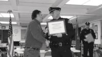 Chief George Merkel presenting a certificate of appreciation to one of the many organizations and individuals that works in partnership with Vergennes PD.