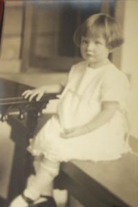 Sitting at the piano at her home in Wisconsin, three year old Mary begins her exploration and love of music and the arts.
