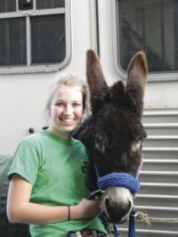 VUHS Future Farmers of America junior Erika Evarts pals around with Green Mountain Donkeyball Donkey Helga before the big game. This new version of March Madness included laughs, smiles and more hitting the court than hitting the basket. All in good fun for everyone!