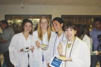 VUHS Seniors Isabelle Hamilton, Lily Hamilton, Daniela Stapleford and Ann Clancy pause to celebrate with some cake and a smile their 2011 high school graduation.