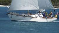 Steering the White Seal across the finish line in a race in Georgetown, Exuma, Bahamas was one of many adventures shared by Mary Langworthy during her 296 day trip with her family while living on a sailboat.