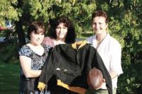 L to R Ralph Emilo’s High School letter jacket and 1931 era football are displayed by his daughters Tina Emilo-Dragon, Roxanna Emilo and Nina Price. Not pictured is Ralph’s other daughter May Ann Gonsalves. Ralph’s sons Ralph, Edwin, David and Michael are also very proud of their Dad. Mr. Emilo passed away in 2000 on New Years Day. He will always be remembered as one of Vermont’s most talented and hard working high school athletes. Mr. Emilo helped his local high school team win a state footbal title in 1931. Our thanks to the Emilo Family and Roch MacIntyre for their help and information with this article. 