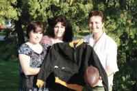L to R Ralph Emilo’s High School letter jacket and 1931 era football are displayed by his daughters Tina Emilo-Dragon, Roxanna Emilo and Nina Price. Not pictured is Ralph’s other daughter May Ann Gonsalves. Ralph’s sons Ralph, Edwin, David and Michael are also very proud of their Dad. Mr. Emilo passed away in 2000 on New Years Day. He will always be remembered as one of Vermont’s most talented and hard working high school athletes. Mr. Emilo helped his local high school team win a state footbal title in 1931. Our thanks to the Emilo Family and Roch MacIntyre for their help and information with this article.