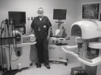 Dennis Maloney displaying some of the equipment used for surgical training in the Virtual Reality Room at the Clinical Simulation Lab. 