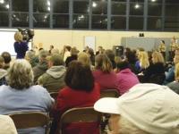 Vergennes Police Chief George Merkel stands before the over two hundred community members who attended the Drug Awareness Community Meeting at the St. Peter's Parish and asks the community to band together to create a zero tolerance for illegal drug use and trafficking. 