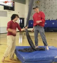 VUHS alumni Theo Spencer shares his passion for circus acrobatics with VUHS student David Johnson.